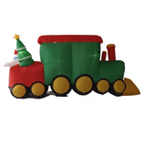 Santa Claus drives a train carrying penguins and polar bears