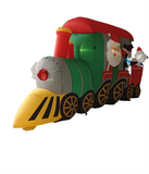 Santa Claus drives a train carrying penguins and polar bears