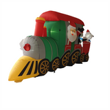 Santa Claus drives a train carrying penguins and polar bears